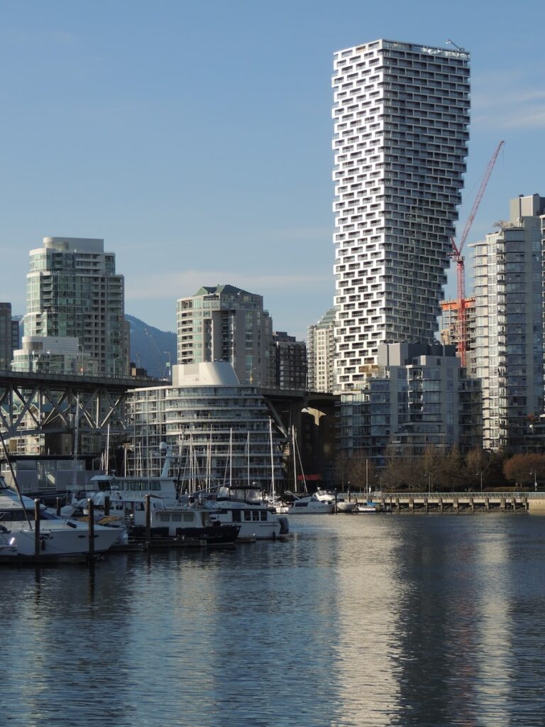 a body of water surrounded by tall buildings